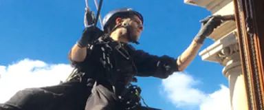 Rope access technician carrying out close inspection and maintenance work